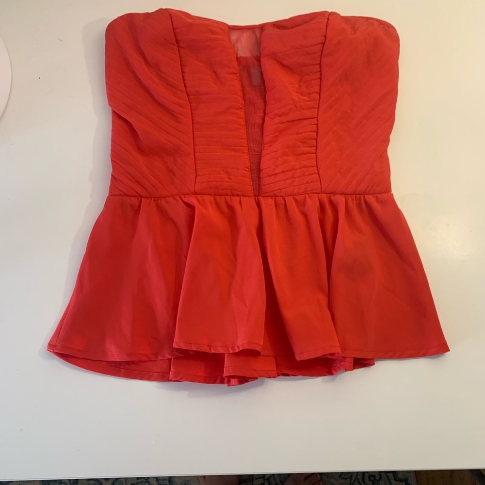 Super cute peplum top with mesh insert